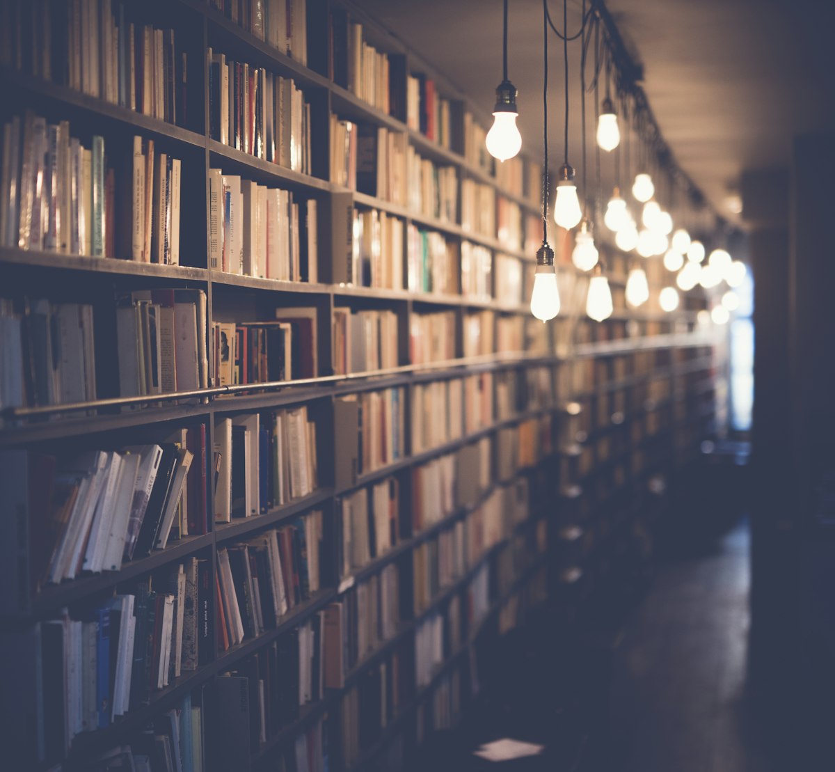 Open book and notes on a wooden desk